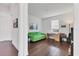 Bright living room offers a comfy sofa, a study desk and hardwood floors at 1014 Calico Gln, Bradenton, FL 34212