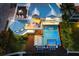 Aerial view of home highlighting the pool, spa, rooftop deck, and multiple outdoor entertaining areas at 110 10Th S St, Bradenton Beach, FL 34217