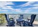 Spacious balcony with comfortable seating and stunning views of the water at 110 10Th S St, Bradenton Beach, FL 34217