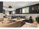 Finished basement with large sofa, projector, and plenty of room for entertaining at 110 10Th S St, Bradenton Beach, FL 34217