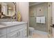 Elegant powder room with beautiful mirror, neutral textures, and seahorse decor at 110 10Th S St, Bradenton Beach, FL 34217