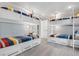 Bright bunk room featuring four built-in bunk beds and storage at 110 10Th S St, Bradenton Beach, FL 34217
