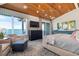 Bedroom with sitting area, balcony access, and water views at 110 10Th S St, Bradenton Beach, FL 34217