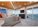 Bedroom featuring vaulted ceiling, balcony access, and water views at 110 10Th S St, Bradenton Beach, FL 34217