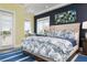 Bright bedroom featuring hardwood floors, art niche and views of the water at 110 10Th S St, Bradenton Beach, FL 34217