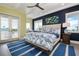 Nautical themed bedroom with tray ceiling, hardwood floors and private access to the balcony at 110 10Th S St, Bradenton Beach, FL 34217