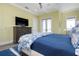 Bedroom features hardwood floors, tray ceiling and balcony access to enjoy the water views at 110 10Th S St, Bradenton Beach, FL 34217
