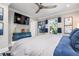 Bright bedroom with a mounted TV and natural light from the window at 110 10Th S St, Bradenton Beach, FL 34217