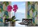 Dining room featuring tropical wallpaper and water view at 110 10Th S St, Bradenton Beach, FL 34217