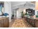 Bright foyer boasts high ceilings, elegant decor, wood floors, and access to other rooms at 110 10Th S St, Bradenton Beach, FL 34217