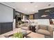 Spacious game room with arcade games, comfortable seating, and a projector screen at 110 10Th S St, Bradenton Beach, FL 34217