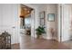 Hallway featuring wood flooring, white trim, and art at 110 10Th S St, Bradenton Beach, FL 34217