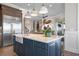 Spacious kitchen features a large island, stainless steel appliances, and modern lighting at 110 10Th S St, Bradenton Beach, FL 34217