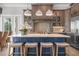 Stunning kitchen featuring a spacious island with seating, custom cabinetry, and high-end finishes at 110 10Th S St, Bradenton Beach, FL 34217