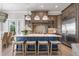 Beautiful kitchen with a large island, pendant lighting, and stainless steel appliances, perfect for cooking and entertaining at 110 10Th S St, Bradenton Beach, FL 34217