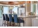 Bright kitchen island seats four, features stainless fridge, pendant lights, and designer cabinets at 110 10Th S St, Bradenton Beach, FL 34217