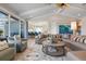 Inviting living room flows to the kitchen and features stylish furnishings and ample natural light at 110 10Th S St, Bradenton Beach, FL 34217