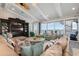 Bright living room features stylish furnishings, elegant decor, water views, and access to the outdoor spaces at 110 10Th S St, Bradenton Beach, FL 34217