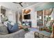 Stylish living room with a comfortable seating arrangement and access to an outdoor area with a summer kitchen at 110 10Th S St, Bradenton Beach, FL 34217
