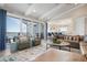 Bright open living room with stylish furniture, spiral staircase access to outdoor patio, and water views at 110 10Th S St, Bradenton Beach, FL 34217