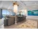 Bright living room features modern decor, stylish rug, ceiling fan, and beautiful ocean view at 110 10Th S St, Bradenton Beach, FL 34217