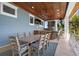 Outdoor dining area with a large table and chairs, ideal for entertaining and enjoying the beautiful weather at 110 10Th S St, Bradenton Beach, FL 34217
