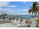 A picturesque outdoor space with a pool, dock, boat lift and waterfront seating, ideal for enjoying waterfront living at 110 10Th S St, Bradenton Beach, FL 34217