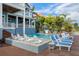 Upscale backyard oasis featuring a beautiful pool area and sun loungers, ideal for outdoor enjoyment and relaxation at 110 10Th S St, Bradenton Beach, FL 34217