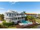 Stunning home featuring a pool, a lounge deck and a spiral staircase leading to a rooftop deck at 110 10Th S St, Bradenton Beach, FL 34217