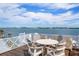 Entertain in style on the rooftop deck, offering panoramic views and comfortable seating around the table at 110 10Th S St, Bradenton Beach, FL 34217