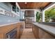 Outdoor summer kitchen featuring a built-in grill and ample countertop space for easy meal preparation at 110 10Th S St, Bradenton Beach, FL 34217
