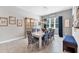 Elegant dining room with stylish chairs, a modern light fixture, and decorative accents at 13306 Deep Blue Pl, Bradenton, FL 34211