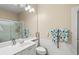 Bathroom with vanity, toilet and a glass enclosed shower with towel racks at 13320 Coluccio St, Venice, FL 34293