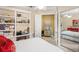 Bedroom with a double bed, built in shelf, closet and mirror at 13320 Coluccio St, Venice, FL 34293