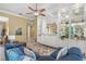 Living room featuring a large sofa, built-in shelving, and view into other rooms of the home at 13320 Coluccio St, Venice, FL 34293