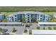 Aerial view of a well-maintained apartment complex with covered parking and lush landscaping at 14061 Heritage Landing Blvd # 412, Punta Gorda, FL 33955