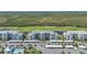 Sprawling aerial view showcasing a golf course, apartment buildings, and lush landscaping at 14061 Heritage Landing Blvd # 412, Punta Gorda, FL 33955