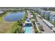 Scenic aerial view of a community with a pool, pond, and well-maintained residences at 14061 Heritage Landing Blvd # 412, Punta Gorda, FL 33955