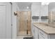 Modern bathroom featuring a glass-enclosed shower and granite countertop at 14061 Heritage Landing Blvd # 412, Punta Gorda, FL 33955