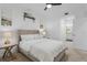 Comfortable bedroom with ensuite bathroom featuring a queen size bed and neutral decor at 14061 Heritage Landing Blvd # 412, Punta Gorda, FL 33955
