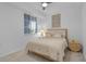 Bedroom with queen bed, ceiling fan, and neutral decor at 14061 Heritage Landing Blvd # 412, Punta Gorda, FL 33955