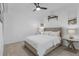 Bedroom with queen bed, ceiling fan, and neutral decor at 14061 Heritage Landing Blvd # 412, Punta Gorda, FL 33955