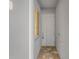 Inviting front entrance featuring a secure white door and stylish brick paver flooring at 14061 Heritage Landing Blvd # 412, Punta Gorda, FL 33955