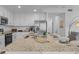 Bright kitchen with white cabinets, granite countertops, stainless steel appliances, and center island at 14061 Heritage Landing Blvd # 412, Punta Gorda, FL 33955