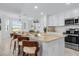 Bright kitchen with an island, granite counters, and modern appliances at 14061 Heritage Landing Blvd # 412, Punta Gorda, FL 33955