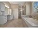 Large bathroom featuring a soaking tub and glass shower at 1511 N Lake Shore Dr, Sarasota, FL 34231