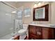 Bathroom featuring a glass shower and wooden vanity at 1511 N Lake Shore Dr, Sarasota, FL 34231