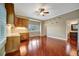 Bedroom with hardwood floors, a ceiling fan, and built-in cabinets at 1511 N Lake Shore Dr, Sarasota, FL 34231