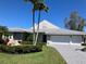 Attractive single-story house with a well-manicured lawn and a spacious three-car garage at 1511 N Lake Shore Dr, Sarasota, FL 34231