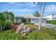 Charming single-story home with a beautifully landscaped front yard and three-car garage at 1511 N Lake Shore Dr, Sarasota, FL 34231